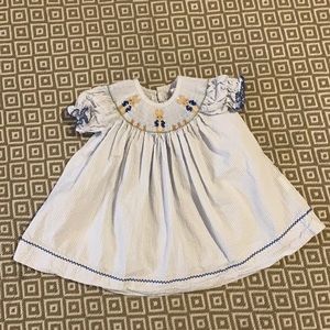 Almost like new ( worn one time), smocked bunny dress made by Stellybelly